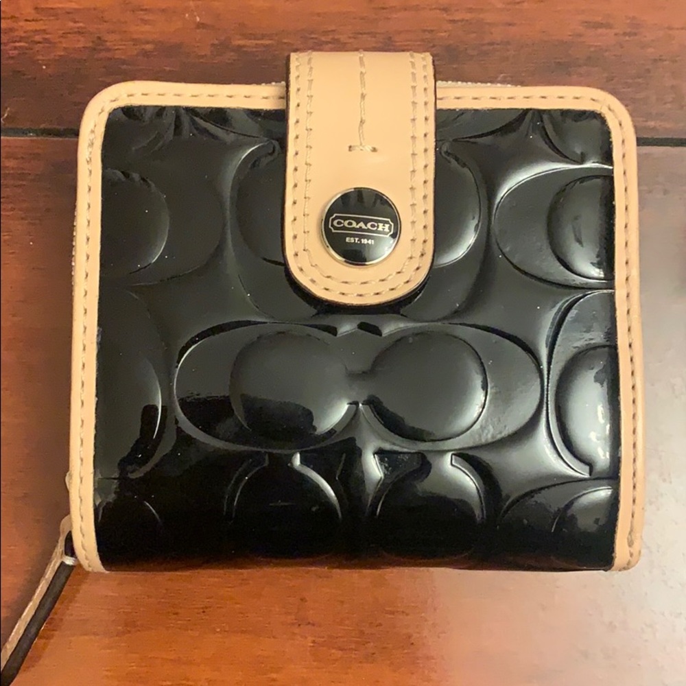 Black patent leather Coach wallet with tan trim
